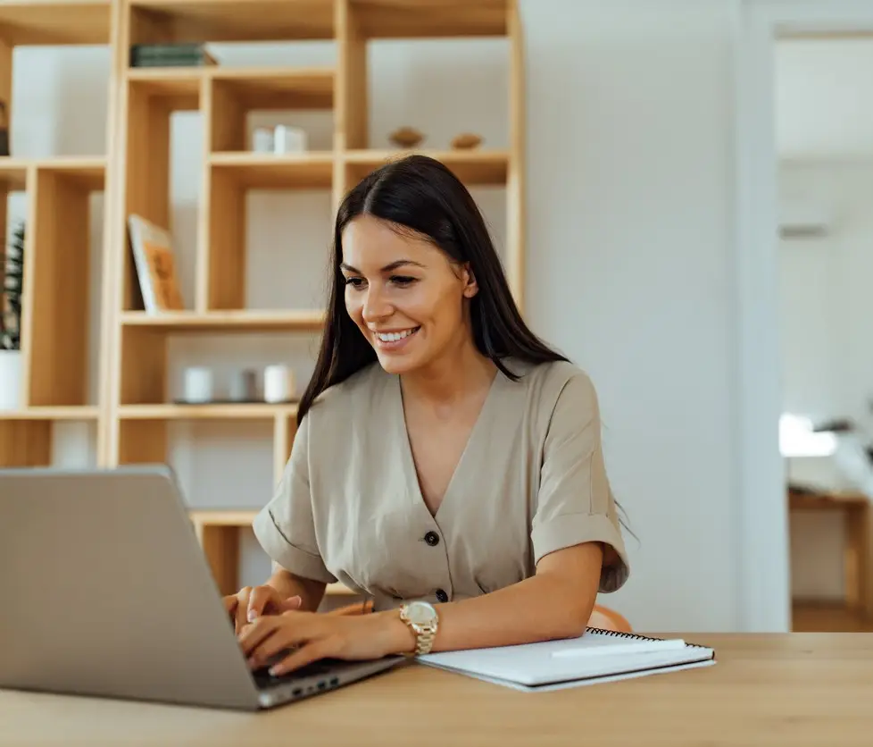 Woman sending an email to someone.